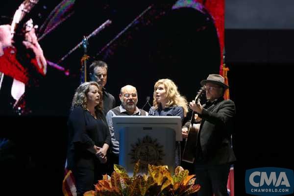 Alison Krauss (second from right) is joined by (left to right) Suzanne Cox, Barry Bales, Sidney Cox, and Ron Block for a performance of "Amazing Grace" during a candlelight vigil Monday at Ascend Amphitheater to honor the victims of the Las Vegas shooting. Photo Credit: Hunter Berry/CMA