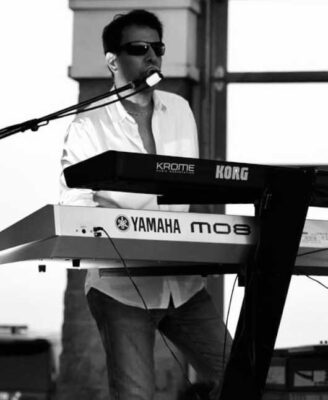 Doug Kistner on keyboard in black and white